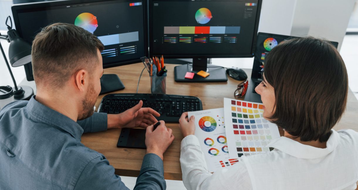 Positive communication. Two designers working together in the office.